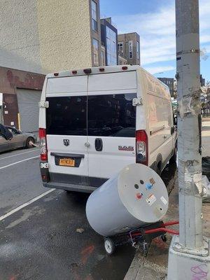 Loading up a defective A.O Smith 50 Gallon water heater, on to Hot&Cold's workhorse check out the license plate! :)