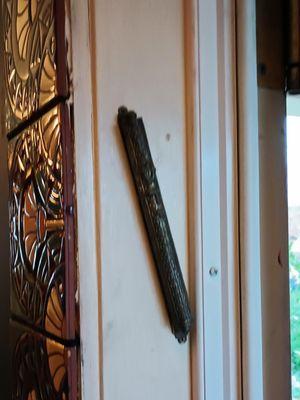 My guess is that the Mezuzah is a welcome holdover from the Malka decorating scheme.