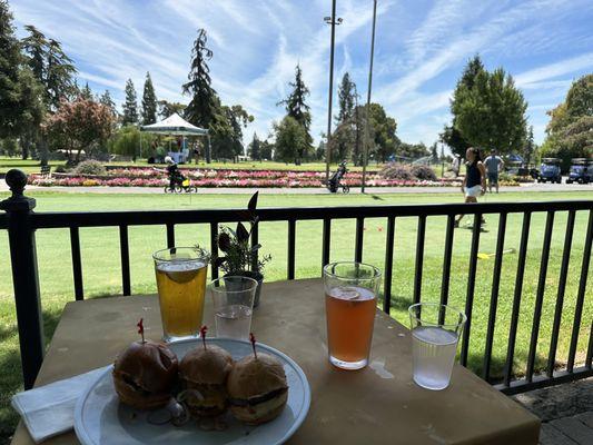 Out door, patio with wagyu sliders, and a couple of cool beverages