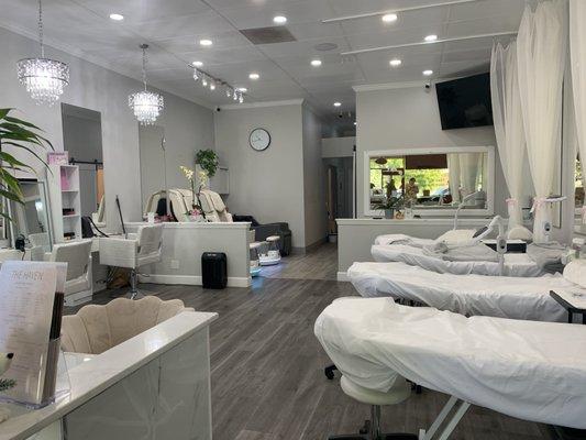 Esthetician/ lash tables and pedicure chairs in the back