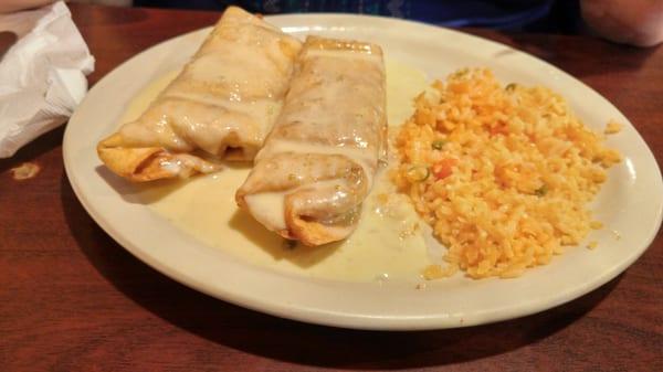 Dos Chimichangas, with lots of creamy cheese on top. Really tasty.