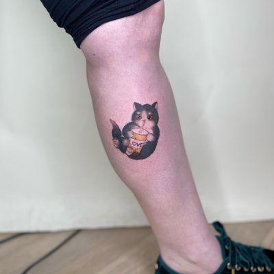 Adorable boba cat tattoo by Jora.