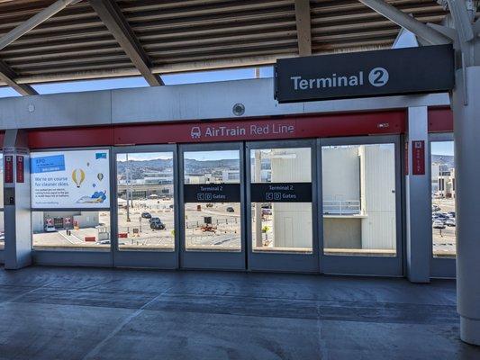 Inside the Terminal 2 AirTrain station, facing one set of the Red Line doors.