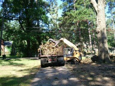 Loading the dump truck at a job in alta woods...