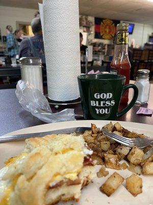 Biscuit, bacon, and eggs, fried potatoes