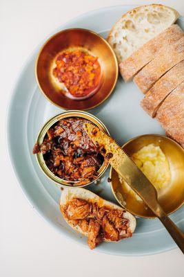 Conservas plate with chili crisp smoked Norwegian salmon and sourdough ciabatta