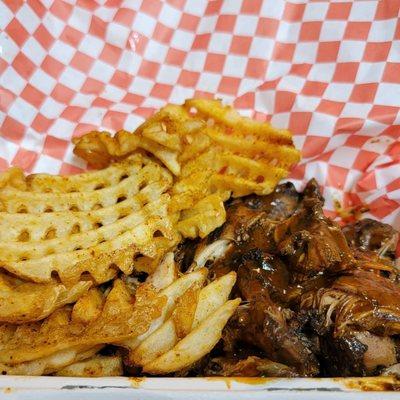 Jerk chicken and creole fries