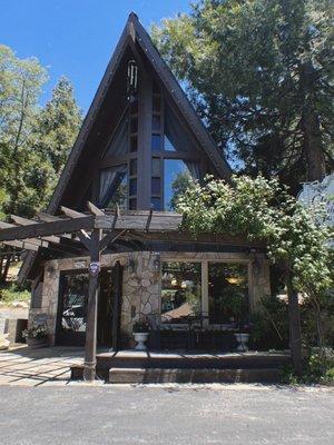 Love the A-frame and stone! Super cute space inside, too.