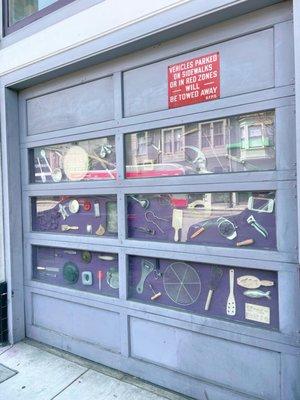 Outside: garage door turned display case. Pretty creative!