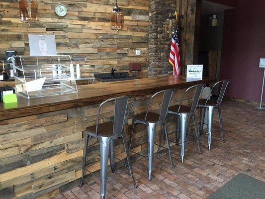 The Branch Café coffee bar - a converted bowling alley, and our pallet wood walls, saved from the landfills and redeemed for new use.