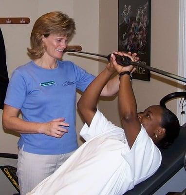 Leanne L. Burns, PT working with patient Axis Physical Therapy Jacksonville, NC