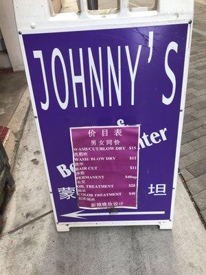 Sandwich board outside Johnny’s Hair Studio in San Francisco's Chinatown.