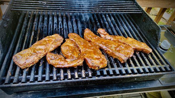 Country pork ribs, you're not gonna find ribs like this for seven dollars and change... Smoking it with Cherry pellets.