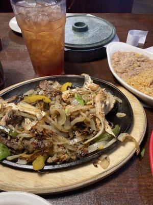 Steak and Chicken Fajitas. Rice/beans. Not pictured: sour cream, guac and cilantro, onions and jalapeños. 6 warm tortillas