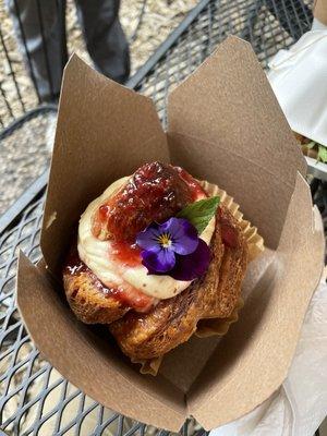 Cruffin with strawberry jam and custard