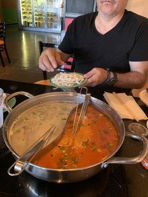 Vegetarian broth on the left and Tom Yum on the right. Delicious