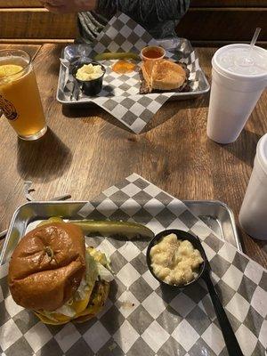 Brisket with potato salad and a smash burger with white Mac and cheese