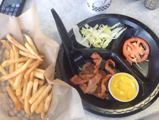 Not what I expected at all.  Mediocre burger hockey puck size with teeny tomato and a few slivers of lettuce and dry fries.