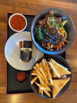 The whole spread: Bibimkooksoo, fried Korean Chicken Sandwich, and spam Musubi