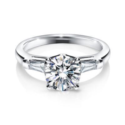 Round diamond with baguette. Classic setting, very elegant.