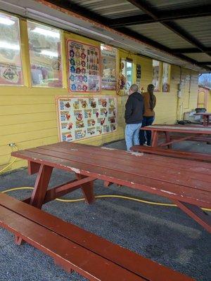 Eating area, Cream Corn Stand across the taco truck