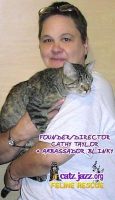 Director Cathy Taylor holding Blinky, Catz Jazz Ambassador