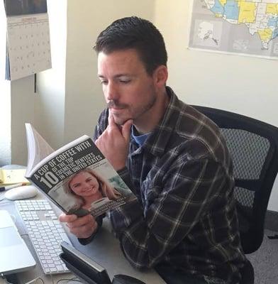 Chris, our Director of Dental Consulting, checking out a few of our clients in their new book.