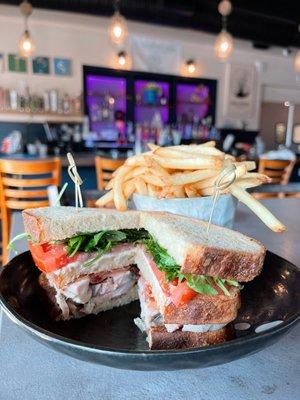 A really good sandwich! chicken confit, bacon, tomato, arugula, whole grain mustard, mayo on sourdough toast and fries