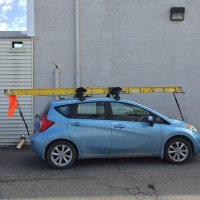 Big ladder, little car.