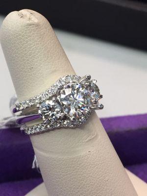 Engagement ring with curved wedding bands