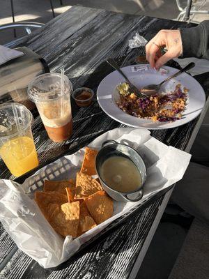 Fresh squeezed orange juice, dirty chai, chips and queso blanco, quinoa bowl