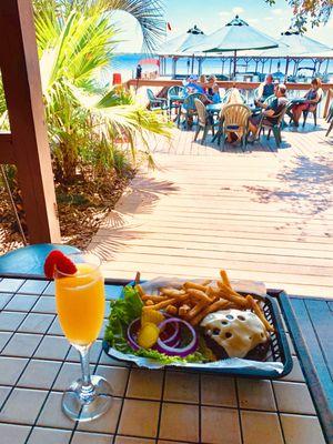 Swiss Burger with Fries and a Mimosa by the Lake