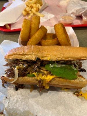 Philly cheesesteak with onion rings.   This is delicious!