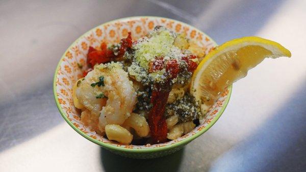 Pesto Shrimp Mac N Cheese - loaded with sun dried tomatoes, cotija cheese, lemon, pesto and grilled shrimp.