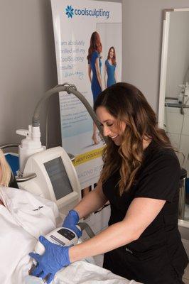 Griffin Churchwell, Aesthetician, administering our CoolSculpting® (non-invasive body contouring) treatment