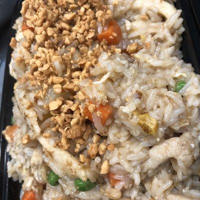 Pineapple coconut fried rice  Topped with peanuts and fried onions