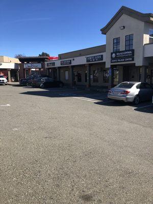 Parking lot, storefronts