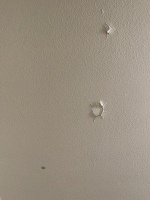 holes in ceiling, maybe water damage ?