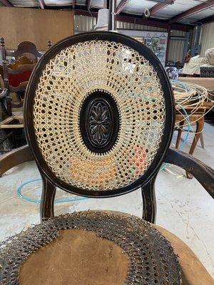 medallion caned back on this armchair