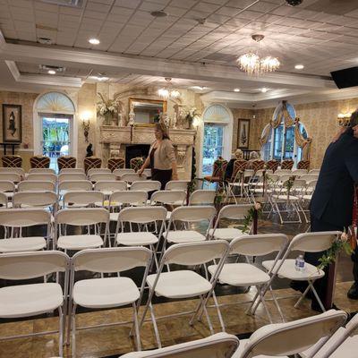 The area for the ceremony gets cleared for the dance floor