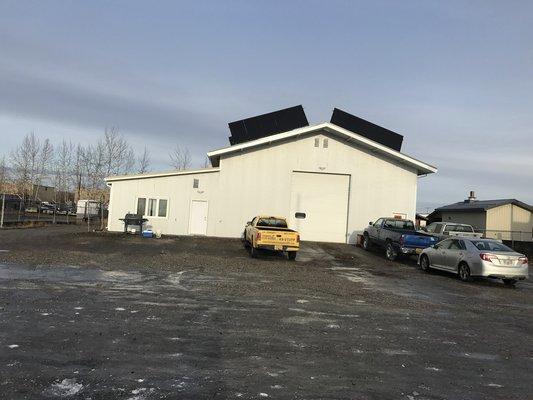 Our shop with the new siding and Solar panels installed