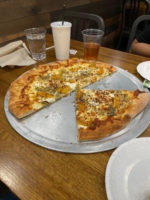 White pizza with artichoke tomatoes ricotta cheese