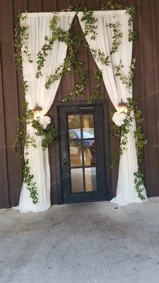 Fabric and ivy wrapping the front door, done by Kevin Griffin.