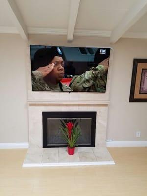 Clean installation of a 65" Samsung TV in a new home.