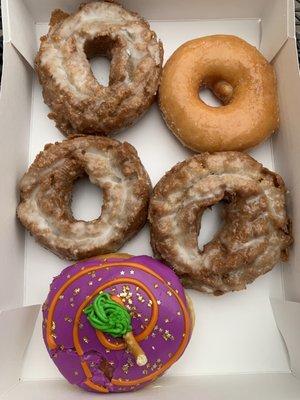 Pumpkin spice donut, regular glazed, and cream filled