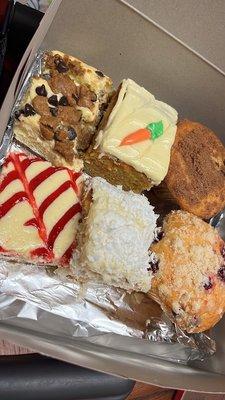 Chocolate chip cheesecake bar, Carrot Cake, Coffee Cake muffin, strawberry cheesecake, coconut cake and lemon raspberry muffin