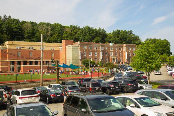 The West Suburban YMCA has a large parking lot that extends around to the back of the building.