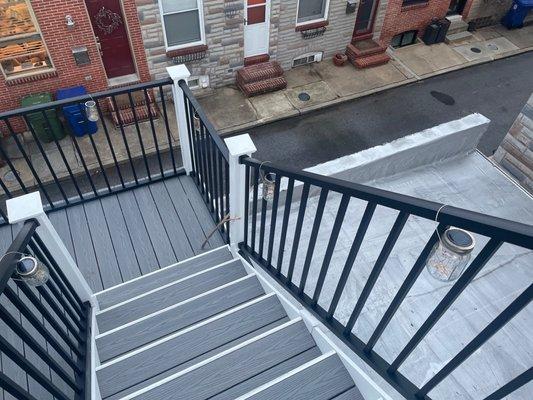 Part of lower deck and roofing over garage to the right redone