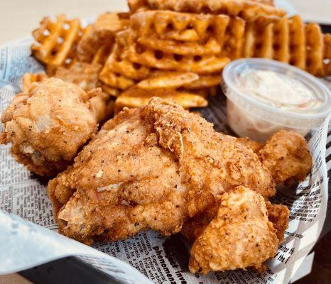 Fried chicken ($8) leg and thigh, waffle fries and slaw.