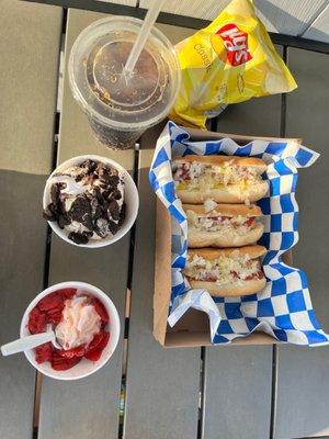 Steamed hotdogs with topping of choice. Strawberry cheesecake scoop in a cup with Oreo pieces. Vanilla Soft serve with strawberries on top.